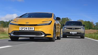 Toyota Prius PHEV and Mazda MX-30 R-EV - front tracking 