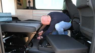 Citroen Holidays - Auto Express chief reviewer, Alex Ingram, folding the rear seats to create the bedding area 