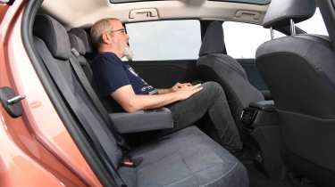 Lexus RZ 300e - rear seat with senior test editor, Dean Gibson