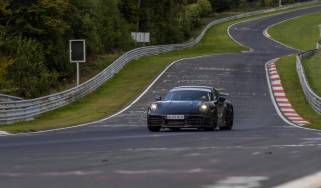 New Porsche 911 front 3/4 round a track