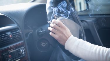 Smoking cigarette in car