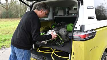 Auto Express editor Paul Barker loading the Volkswagen ID. Buzz&#039;s boot with football equipment