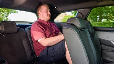 Auto Express news reporter Ellis Hyde sitting in the Peugeot E-5008&#039;s back row