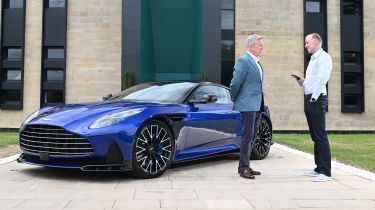 Aston CEO Adrian Hallmark talking to Phil McNamara next to a Vanquish