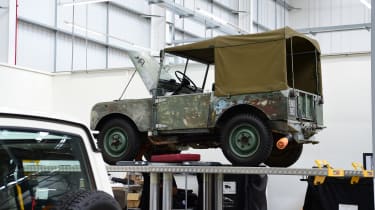 Land Rover Series 1 on a workshop ramp
