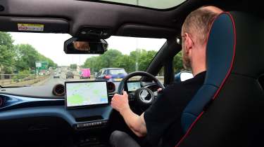 BYD Dolphin interior shot, car being driven by Auto Express chief sub-editor Andy Pringle