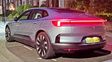 Polestar 4 Dual Motor long-term - rear 3/4 with lights on