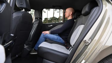 Auto Express chief reviewer Alex Ingram sitting in the Volkswagen ID.3&#039;s back seat