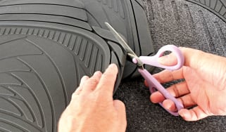 Trimming a floor mat to fit
