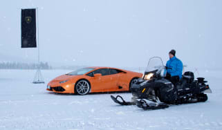 Lamborghini Huracan vs snowmobile