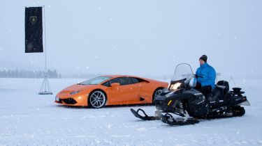 Lamborghini Huracan vs snowmobile