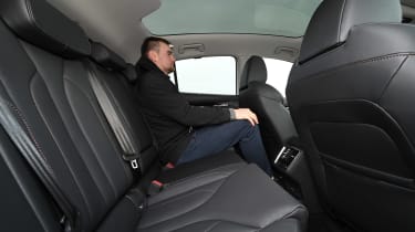 Alastair Crooks sitting in the Skoda Enyaq Coupe 85 Edition Suite