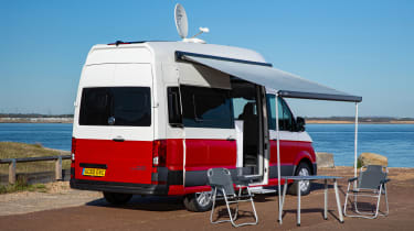 Volkswagen Grand California - side static with awning, table and chairs