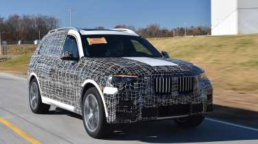 New BMW X7 SUV official spy image front quarter