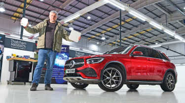 Auto Express consumer editor Chris Rosamond holding Thatcham testing equipment