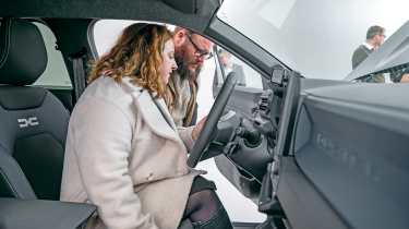 Dacia owners inspecting the Dacia Duster&#039;s steering wheel