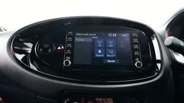 Toyota Aygo X vs Hyundai i10 vs Fiat 500 group test - Toyota Aygo X infotainment screen