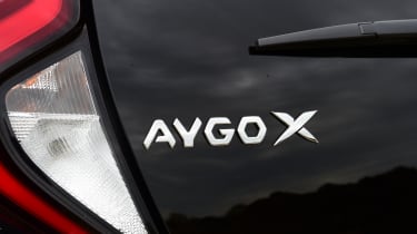 Toyota Aygo X vs Hyundai i10 vs Fiat 500 group test - Toyota Aygo X rear badge