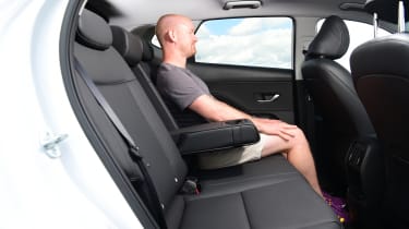 Auto Express chief reviewer Alex Ingram sitting in the Hyundai Kona&#039;s back seat