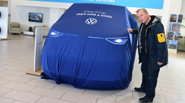 Auto Express editor-in-chief Steve Fowler standing next to the covered Volkswagen ID. Buzz