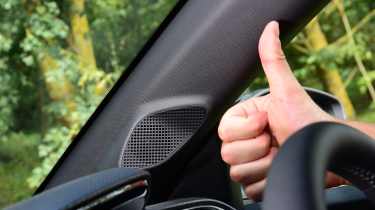 Auto Express senior news reporter Alastair Crooks giving the thumbs up to the audio system in the Vauxhall Corsa 