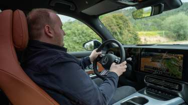 Auto Express news reporter Ellis Hyde driving the Mercedes GLB Electric