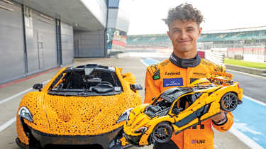 Lando Norris holding a Lego McLaren