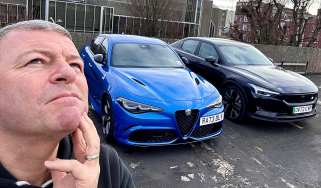 Steve Sutcliffe standing next to an Alfa Romeo Giulia Quadrifoglio and Polestar 2