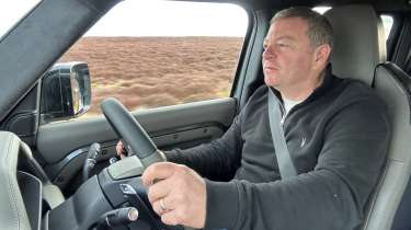 Steve Sutcliffe driving the Land Rover Defender Octa