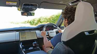 Range Rover Sport SV - interior driving shot with Senior staff writer Jordan Katsianis