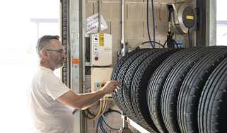 Auto Express Summer Tyre Test 2025 - John Barker inspecting the tyres in the test