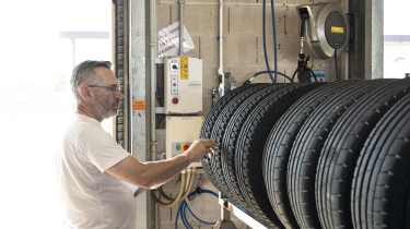 Auto Express Summer Tyre Test 2025 - John Barker inspecting the tyres in the test