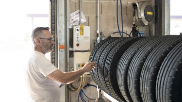Auto Express Summer Tyre Test 2025 - John Barker inspecting the tyres in the test