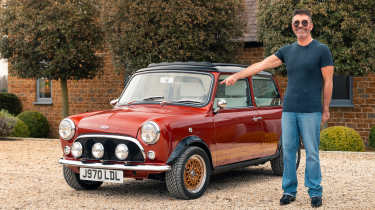 Super Mini Coopers - Simon Cowell stood next to his Mini eMastered