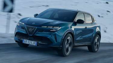 Alfa Romeo Junior Ibrida - dynamic front angled mountain pass