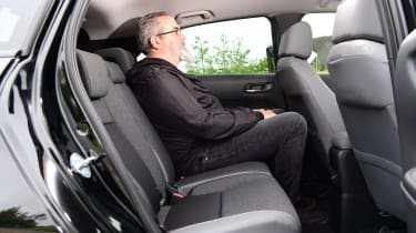 Auto Express senior test editor Dean Gibson sitting in the back seats of the Honda Jazz 