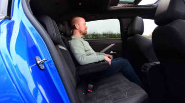 Vauxhall Astra Electric - rear seat with Chief reviewer, Alex Ingram