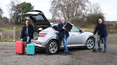 Auto Express chief sub-editor Andy Pringle striking various poses around the Genesis GV60