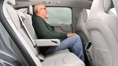 Volvo EX60 2026 - rear seats being sat in by Auto Express senior test editor Dean Gibson