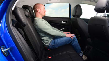 Auto Express chief reviewer Alex Ingram sitting in back seat of Vauxhall Grandland