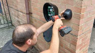 Pod Point technician installing a Pod Point SOLO S3 wallbox charger