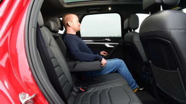 Auto Express chief reviewer Alex Ingram sitting in the Volkswagen Touareg&#039;s back seat