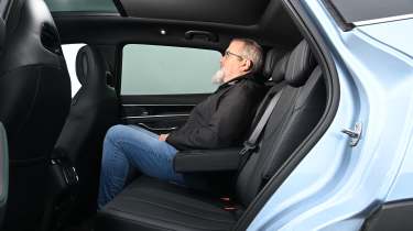 Auto Express senior test editor Dean Gibson sitting in the BYD Seal U&#039;s back seat