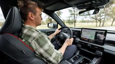 Auto Express senior news reporter Alastair Crooks driving the Toyota RAV4