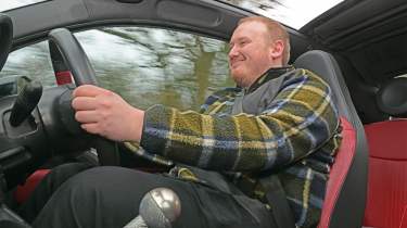 Abarth 600e Scorpionissima - smiling driving the 595