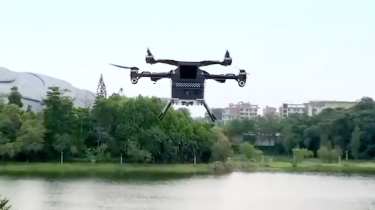 XPeng Aero HT ‘flying car’ - flying module over lake