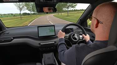 Alex Ingram driving the BYD Dolphin Surf Comfort