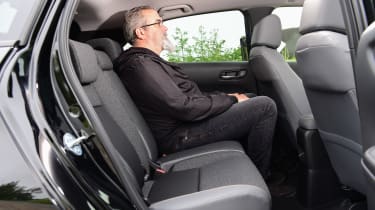 Auto Express senior test editor Dean Gibson sitting in back seat of Honda Jazz