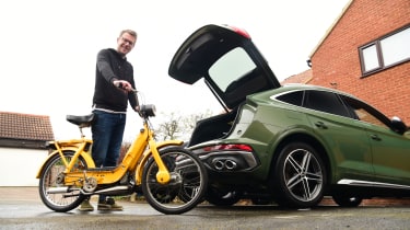 Sean Carson loading a bike into Audi SQ5