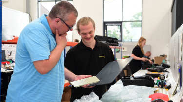 Andersen employee demonstrating Andersen components to John McIlroy